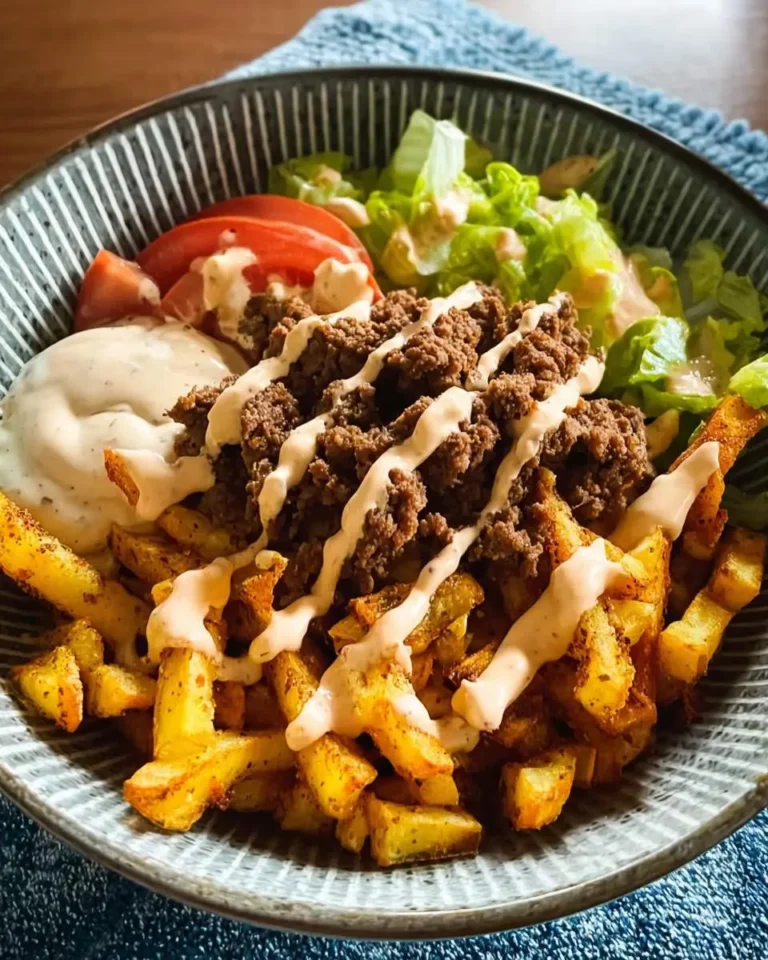 Burger Bowls with House Sauce and Ranch Fries featuring seasoned fries topped with ground beef, drizzled sauce, lettuce, and tomato.