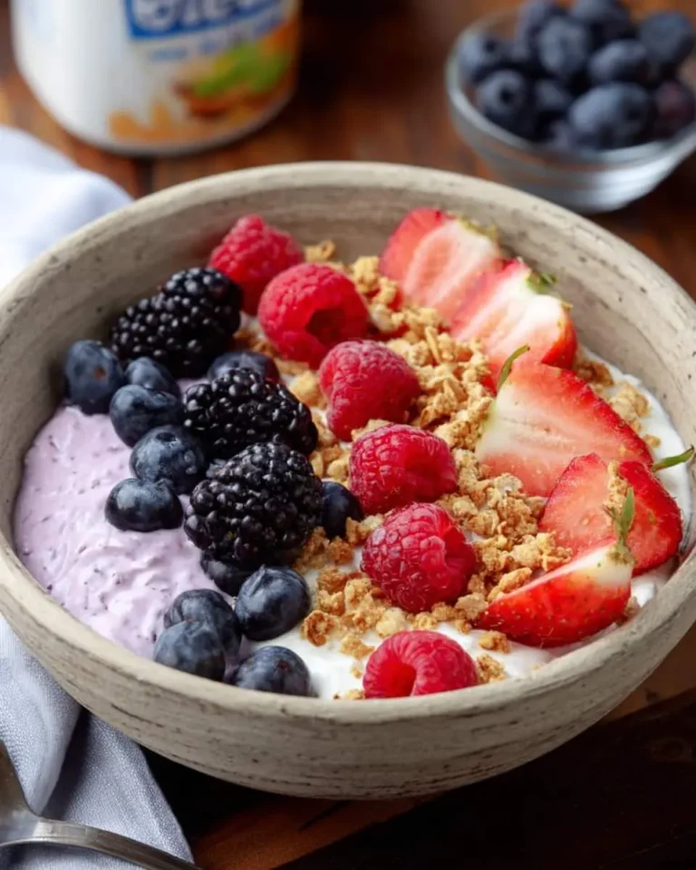 Cottage Cheese–Berry Bowl topped with fresh strawberries, raspberries, blackberries, blueberries, and granola in a ceramic bowl.