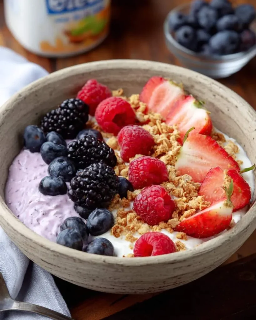 Cottage Cheese–Berry Bowl topped with fresh strawberries, raspberries, blackberries, blueberries, and granola in a ceramic bowl.